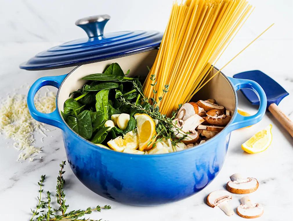 Vegetarian one pot pasta with mushrooms, zucchini, and spinach
